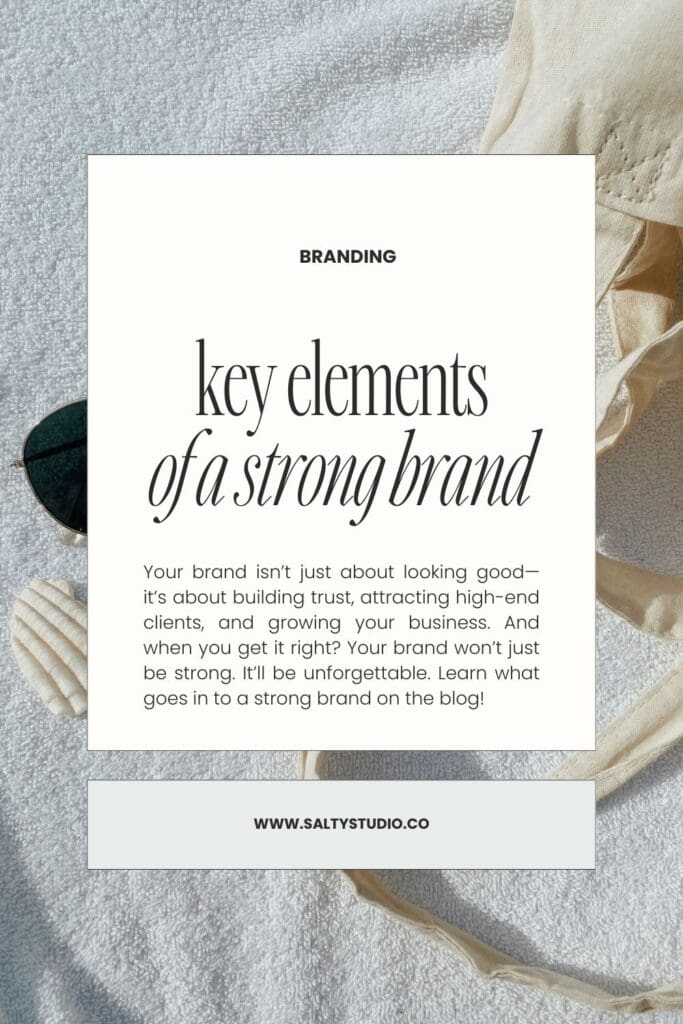 Branding graphic on textured background, featuring the text 'Key elements of a strong brand.'’ Nearby are sunglasses, seashells, and fabric. Calm, professional tone.